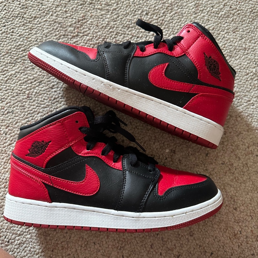 Jordan 1 Mid “Banned” Red color way. Size 7Y, Size 8 women’s/size 7 men’s